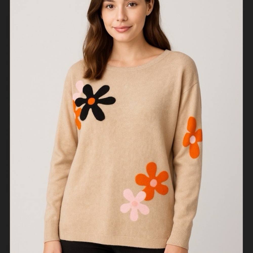 Aaeda boatneck sweater with vibrant flowers.